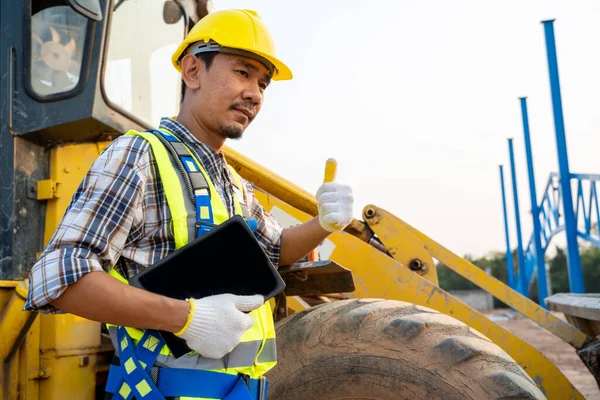 yaweh-stock-photo-construction-worker-backhoe-loader.jpg